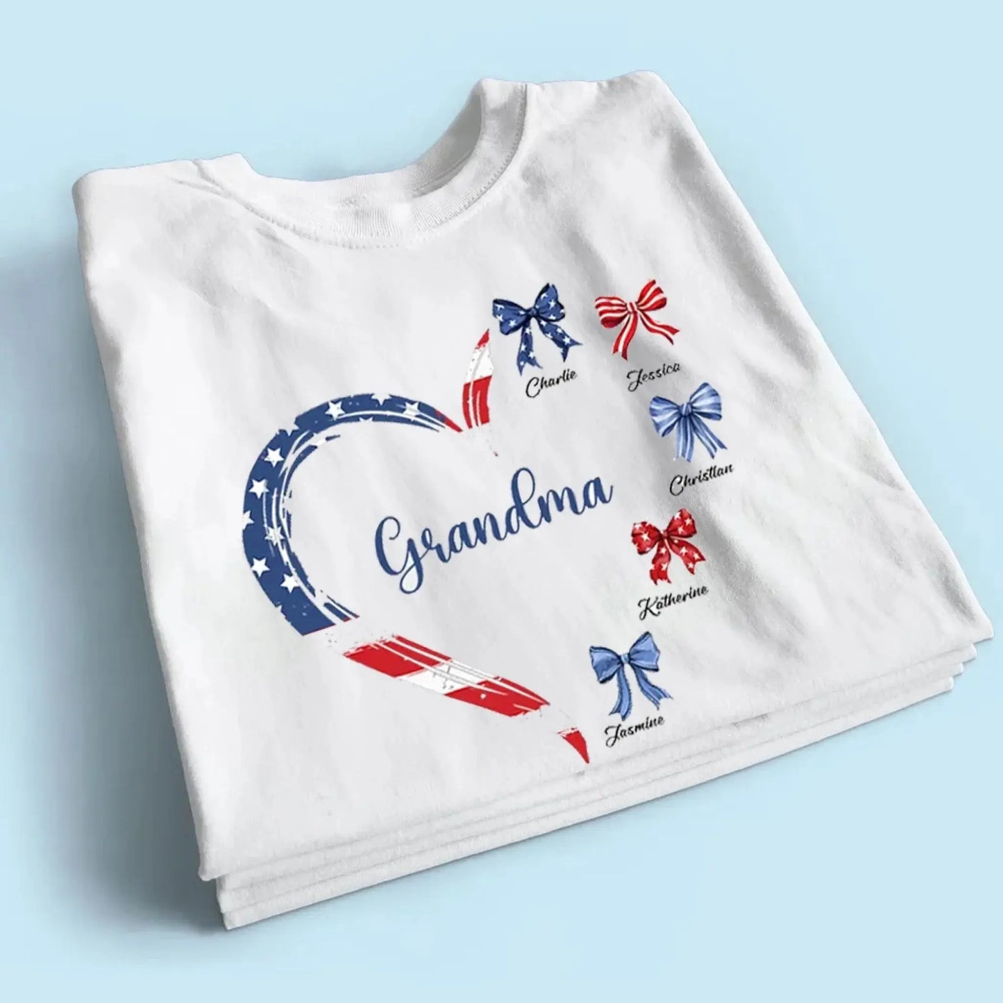 Proud American Grandma Shirt – Personalized Heart Bow T-Shirt with Grandkids' Names – 4th of July Gift for Mom, Nana, Mimi Ezcustomize