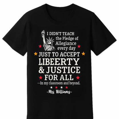 black T-shirt featuring a bold white and red graphic of the Statue of Liberty and the quote I didnt teach the Pledge of Allegiance every day just to accept anything less than liberty justice for all — In my classroom and beyond.